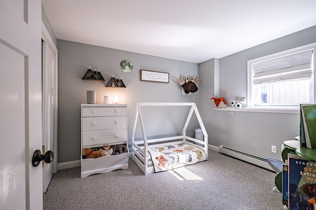carpeted bedroom with baseboards and a baseboard heating unit