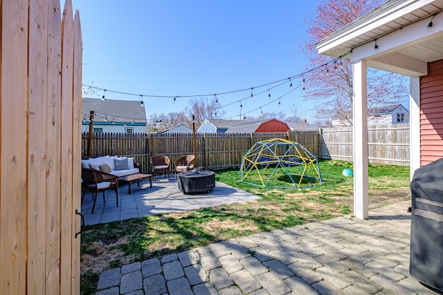 view of patio / terrace with a fenced backyard and an outdoor fire pit