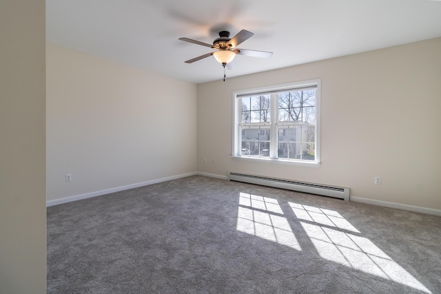 carpeted empty room featuring ceiling fan, a baseboard heating unit, and baseboards