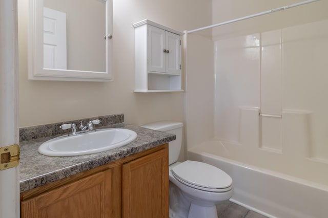 bathroom featuring vanity, toilet, and shower / washtub combination