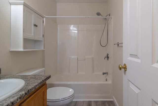 bathroom with shower / bath combination, vanity, toilet, and wood finished floors