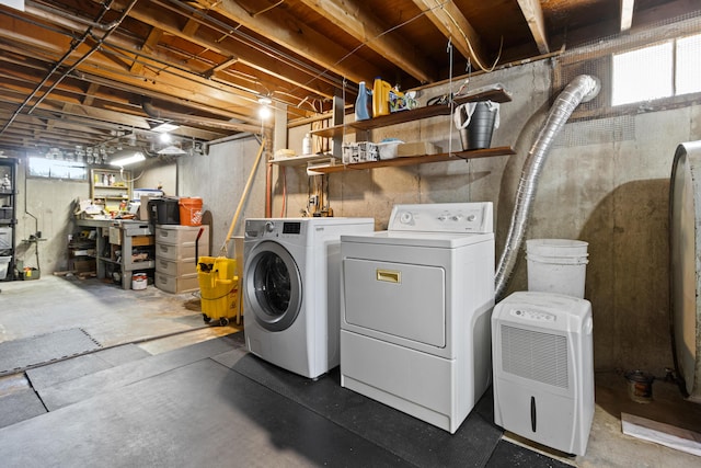 washroom with separate washer and dryer and laundry area