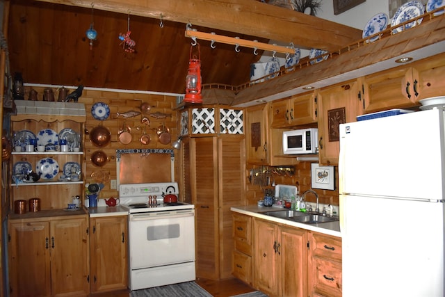 158 Old Stage Rd, Readfield, ME 04355 - kitchen with white appliances, brown cabinetry, a sink, and light countertops