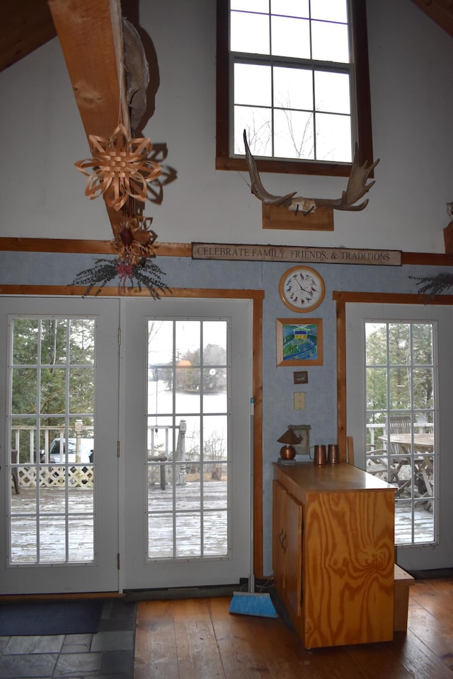158 Old Stage Rd, Readfield, ME 04355 - entryway featuring a towering ceiling, a water view, a healthy amount of sunlight, and hardwood / wood-style floors