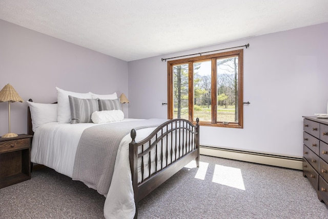 bedroom featuring carpet floors and a baseboard radiator