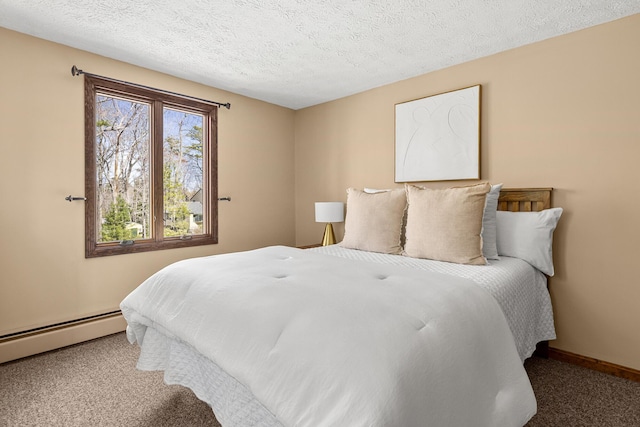 carpeted bedroom featuring baseboards, baseboard heating, and a textured ceiling