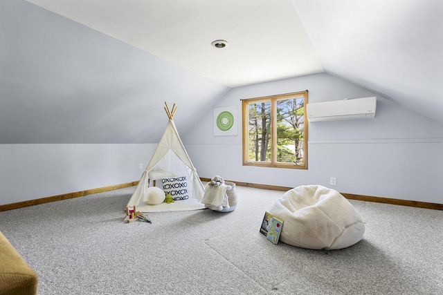 recreation room featuring baseboards, carpet, vaulted ceiling, and a wall mounted air conditioner