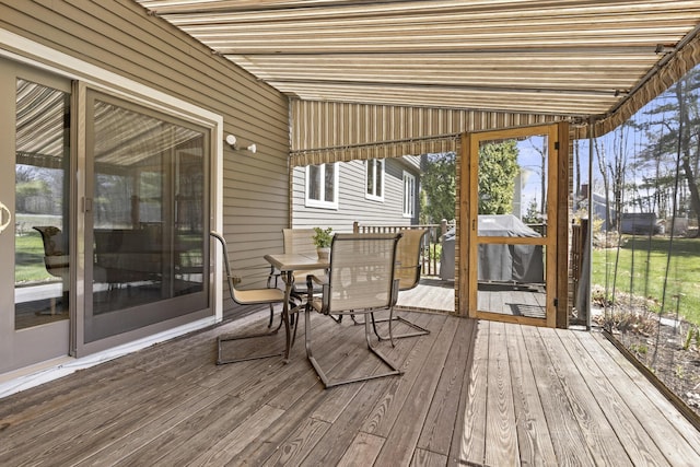 sunroom / solarium with outdoor dining area