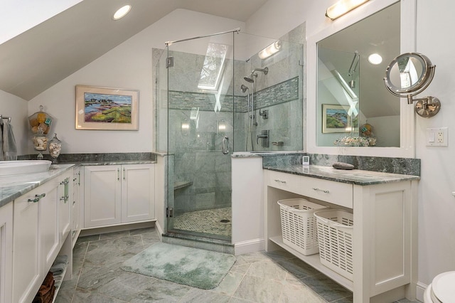 bathroom with vanity, recessed lighting, vaulted ceiling, and a stall shower
