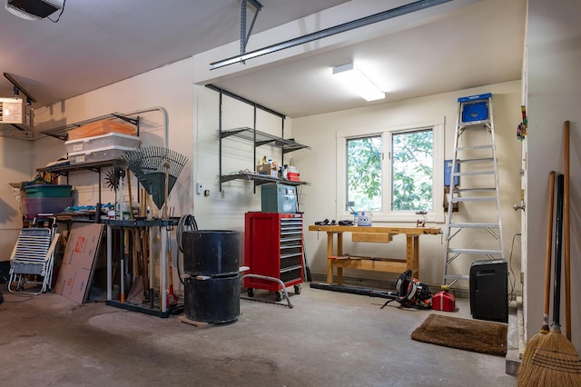 garage featuring a workshop area and a garage door opener