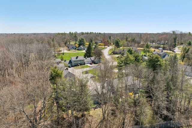 birds eye view of property with a wooded view