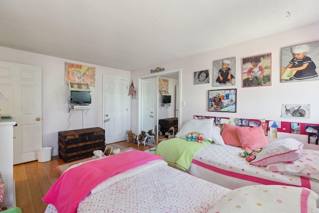 bedroom with wood finished floors