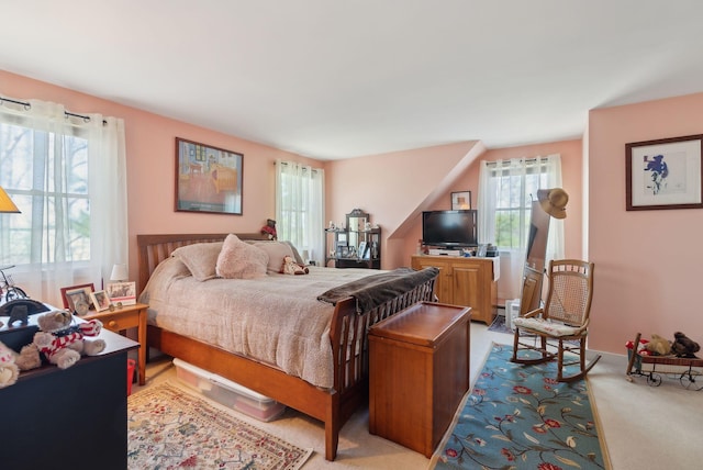 bedroom featuring light colored carpet