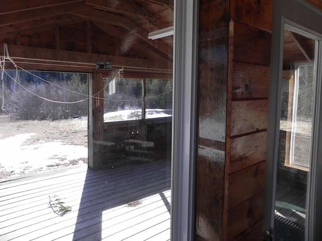 doorway featuring vaulted ceiling