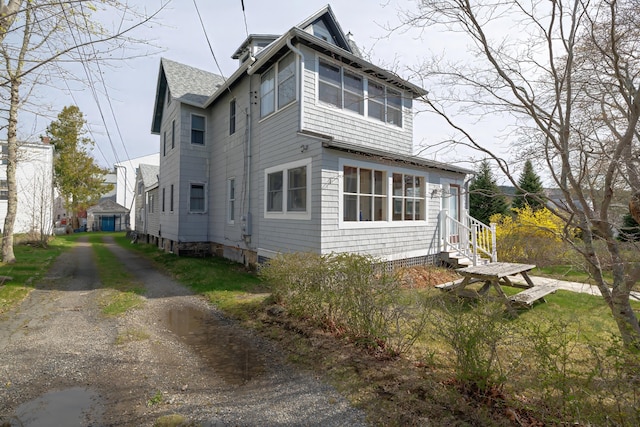 6 Sea St, Northeast Harbor, Mount Desert, ME 04662 - view of side of home with a shingled roof