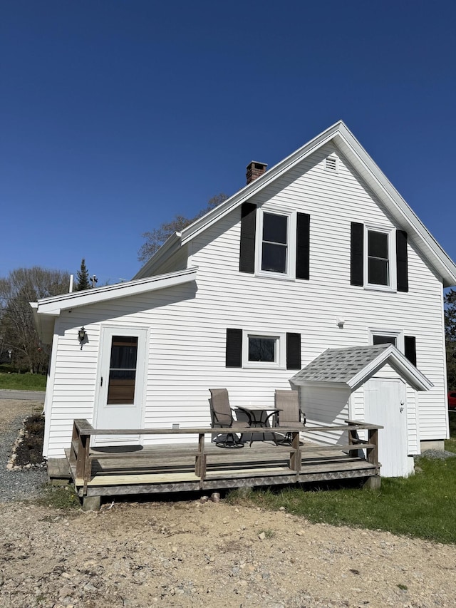 30 Mill St, Harrington, ME 04643 - rear view of property with a deck, a chimney, and a shed