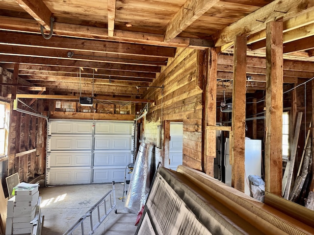 30 Mill St, Harrington, ME 04643 - garage with a garage door opener and wood walls
