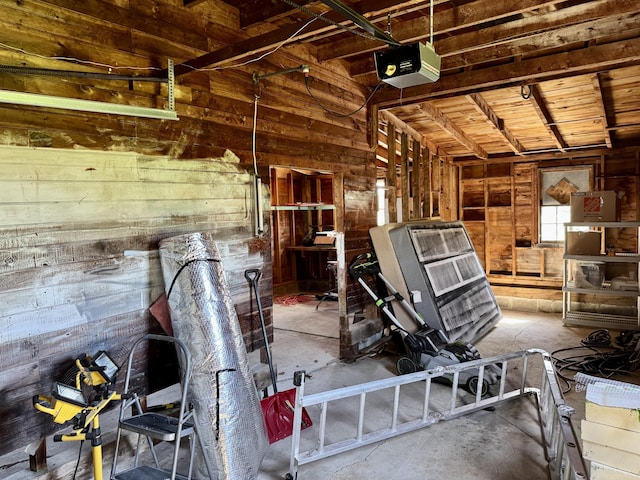 30 Mill St, Harrington, ME 04643 - miscellaneous room featuring wood walls, unfinished concrete flooring, and wooden ceiling