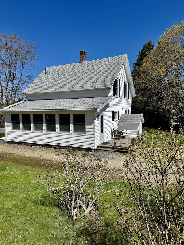 30 Mill St, Harrington, ME 04643 - back of property with a shingled roof, a chimney, and a deck