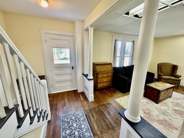 30 Mill St, Harrington, ME 04643 - foyer entrance featuring wood finished floors, healthy amount of natural light, stairs, decorative columns, and a drop ceiling