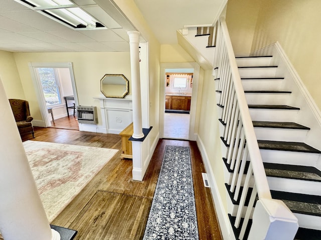 30 Mill St, Harrington, ME 04643 - stairway with heating unit, wood finished floors, and baseboards