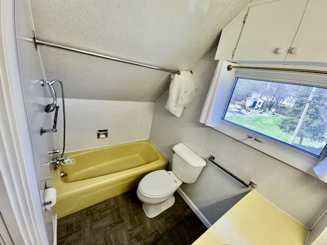 30 Mill St, Harrington, ME 04643 - full bathroom featuring toilet, lofted ceiling, and tub / shower combination