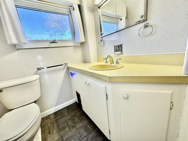 30 Mill St, Harrington, ME 04643 - half bathroom with toilet, vanity, and baseboards