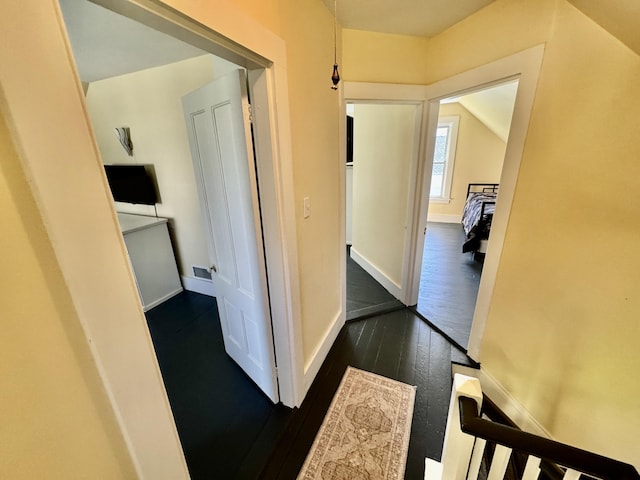 30 Mill St, Harrington, ME 04643 - hallway with dark wood-style flooring and baseboards