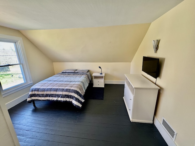 30 Mill St, Harrington, ME 04643 - bedroom with lofted ceiling, dark wood finished floors, and baseboards