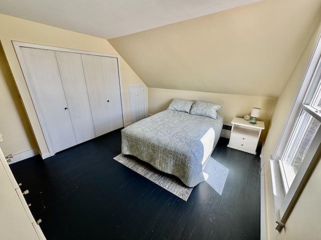 30 Mill St, Harrington, ME 04643 - bedroom with vaulted ceiling, dark wood finished floors, and a closet