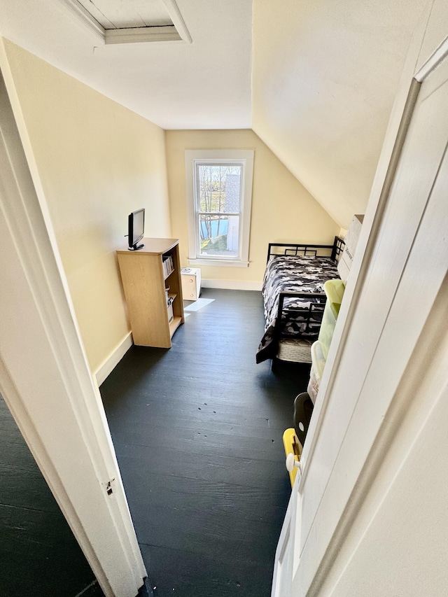 30 Mill St, Harrington, ME 04643 - bedroom with baseboards, lofted ceiling, dark wood-style flooring, and attic access