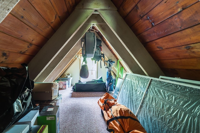 bedroom featuring wood ceiling, carpet, and lofted ceiling