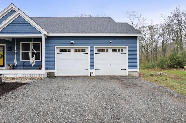29 Hawks Nest Ln, Wells, ME 04090 - garage featuring driveway and a porch