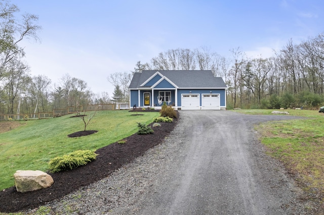 29 Hawks Nest Ln, Wells, ME 04090 - view of front of home featuring dirt driveway, a garage, and a shingled roof