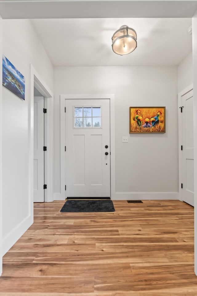 29 Hawks Nest Ln, Wells, ME 04090 - entryway with baseboards and light wood-type flooring
