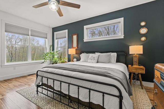 29 Hawks Nest Ln, Wells, ME 04090 - bedroom with baseboards, wood finished floors, and a ceiling fan