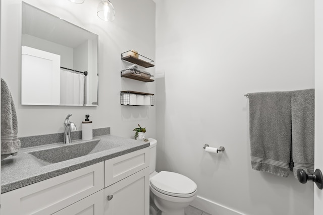 29 Hawks Nest Ln, Wells, ME 04090 - full bathroom featuring toilet, vanity, tile patterned floors, and baseboards