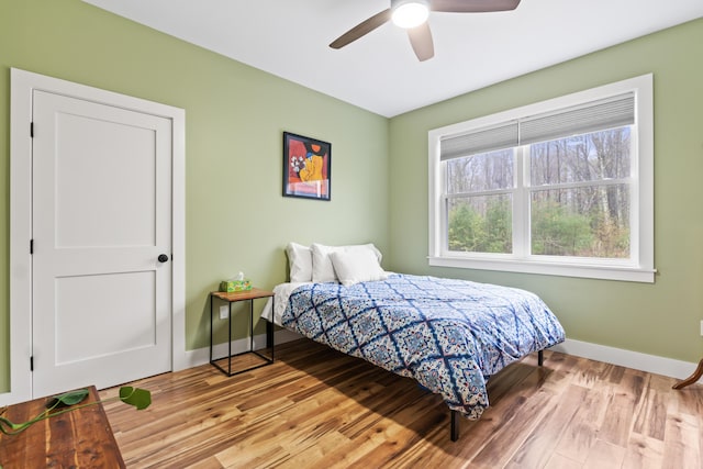 29 Hawks Nest Ln, Wells, ME 04090 - bedroom featuring baseboards, light wood-style flooring, and a ceiling fan