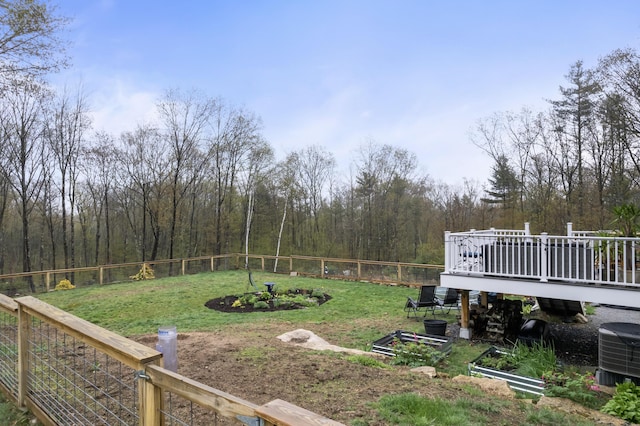 29 Hawks Nest Ln, Wells, ME 04090 - view of yard featuring a wooden deck, cooling unit, and a view of trees