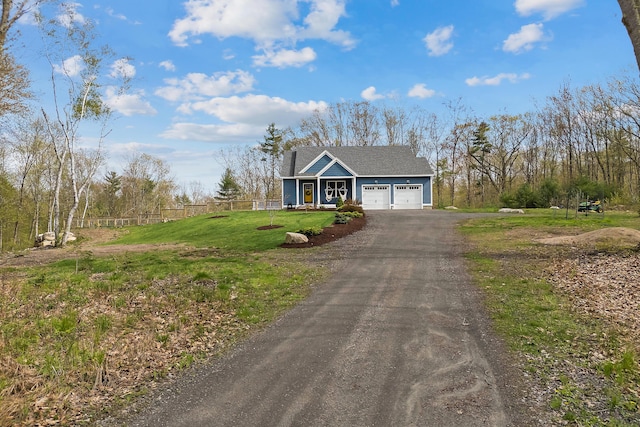 29 Hawks Nest Ln, Wells, ME 04090 - view of front of house with a garage, asphalt driveway, and roof with shingles