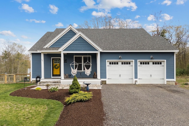 29 Hawks Nest Ln, Wells, ME 04090 - view of front of property with covered porch, an attached garage, a shingled roof, gravel driveway, and fence