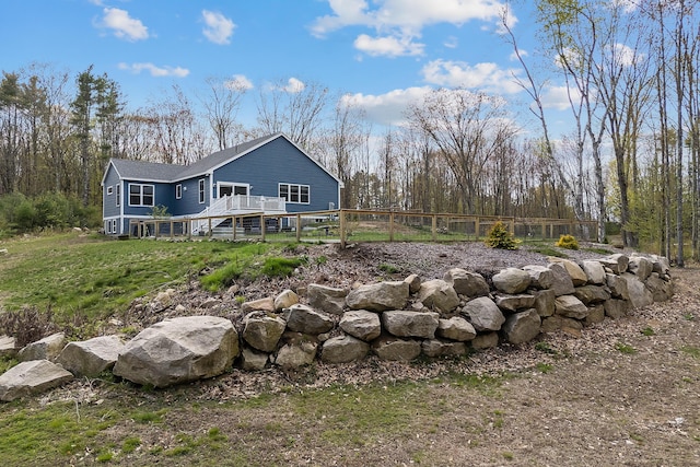 29 Hawks Nest Ln, Wells, ME 04090 - view of yard featuring a deck, fence, and a forest view