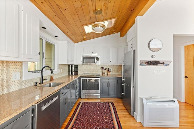 1588 Turtle Head Rd, Islesboro, ME 04848 - kitchen featuring stainless steel appliances, a sink, white cabinetry, light stone counters, and wooden ceiling
