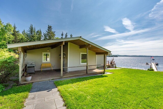 1588 Turtle Head Rd, Islesboro, ME 04848 - view of front of home featuring a water view and a front lawn