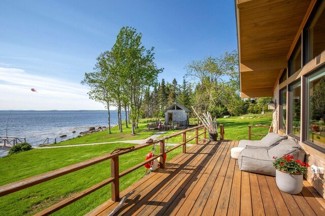 1588 Turtle Head Rd, Islesboro, ME 04848 - wooden terrace with a water view and a lawn