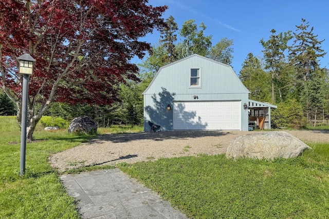 1588 Turtle Head Rd, Islesboro, ME 04848 - view of property exterior featuring a gambrel roof, a detached garage, an outbuilding, and a lawn