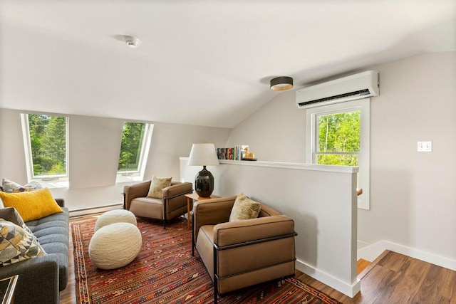 1588 Turtle Head Rd, Islesboro, ME 04848 - living area with a wall unit AC, a baseboard radiator, wood finished floors, baseboards, and lofted ceiling