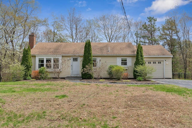 48 Woodside Dr, Kennebunk, ME 04043 - ranch-style home featuring a garage, a chimney, asphalt driveway, and a front yard