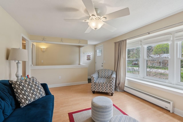 48 Woodside Dr, Kennebunk, ME 04043 - living room with a baseboard radiator, wood finished floors, plenty of natural light, and ceiling fan
