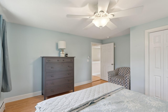 48 Woodside Dr, Kennebunk, ME 04043 - bedroom featuring light wood-type flooring, a baseboard heating unit, a closet, and baseboards